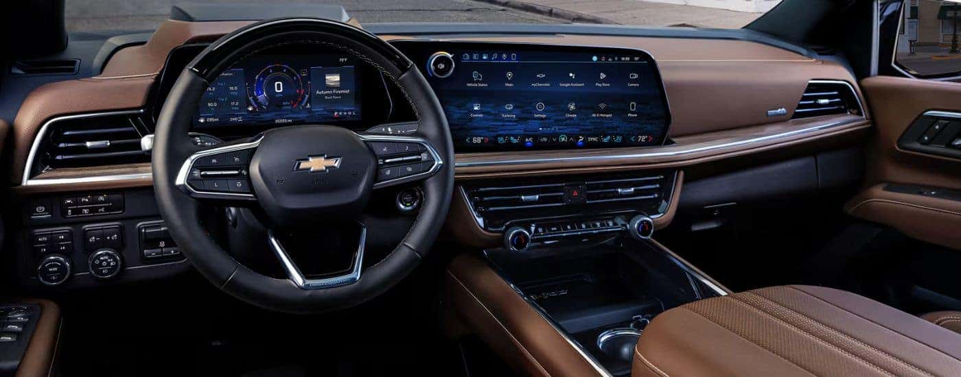 The brown interior and dashboard with infotainment display on a 2026 Chevy Suburban.