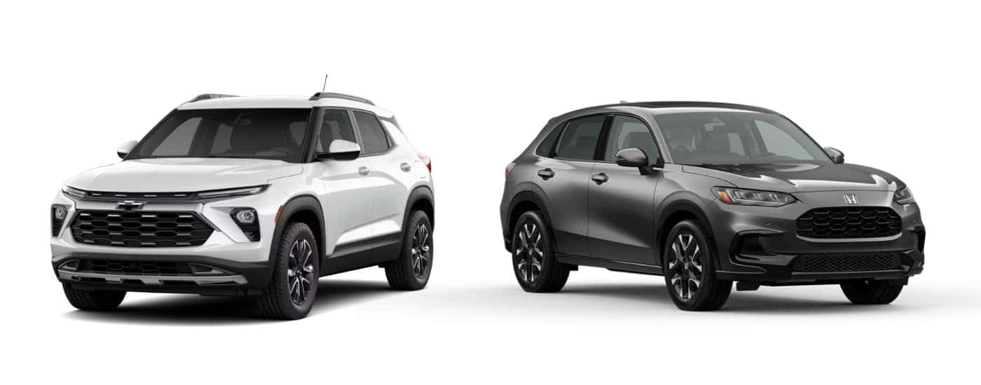 A white 2027 Chevy Trailblazer angled left and a gray 2027 Honda HR-V angled right.