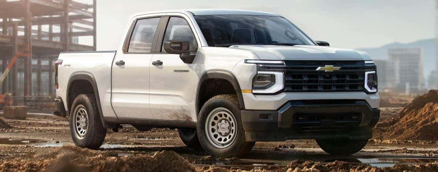 A white 2027 Chevy Silverado 1500 parked on a job site.