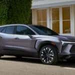 Grey 2026 Chevy Blazer EV parked by a curb.