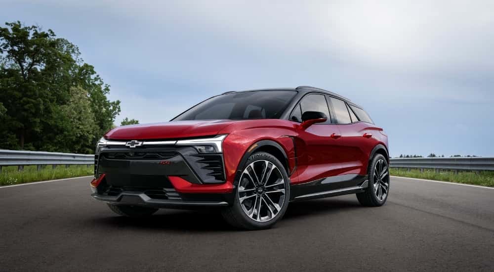 Red 2026 Chevy Blazer EV parked on a road.