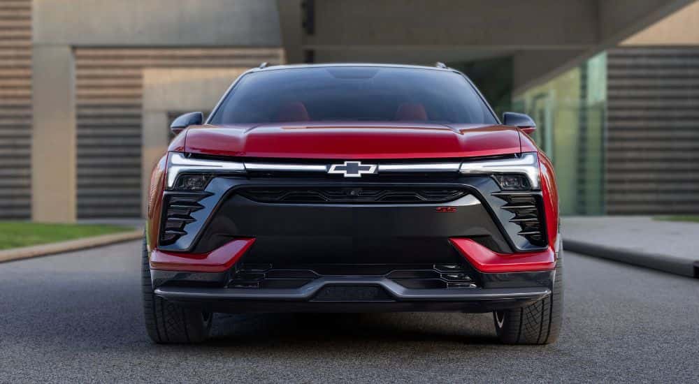 Front of a red 2026 Chevy Blazer EV parked on a driveway.
