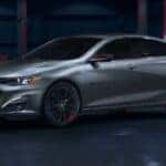 A silver 2024 Chevy Malibu Redline parked in a warehouse