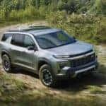A silver 2027 Chevy Traverse Z71 driving off-road.