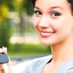 Pretty girl showing the car key