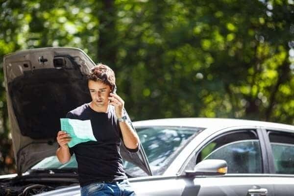 Man calling help broke down on the side of the road