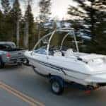 2020 toyota tacoma towing a boat on a highway