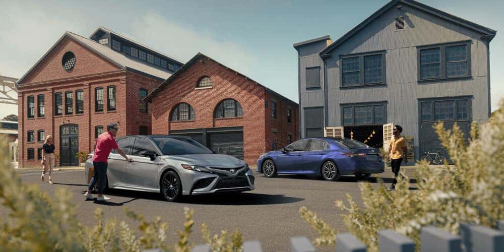 2021 Toyota Camry parked next to warehouse