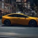 2025 Toyota Prius driving through city streets