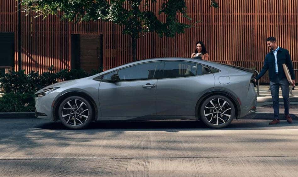 Side view of the 2025 Toyota Prius Prime parked in an urban setting