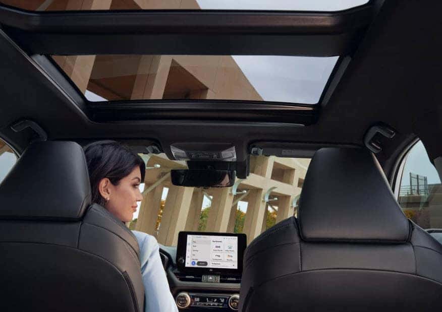 Interior of the 2025 Toyota RAV4 Hybrid with panoramic sunroof and infotainment display