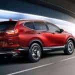 Red 2018 Honda CR-V traveling through a tunnel