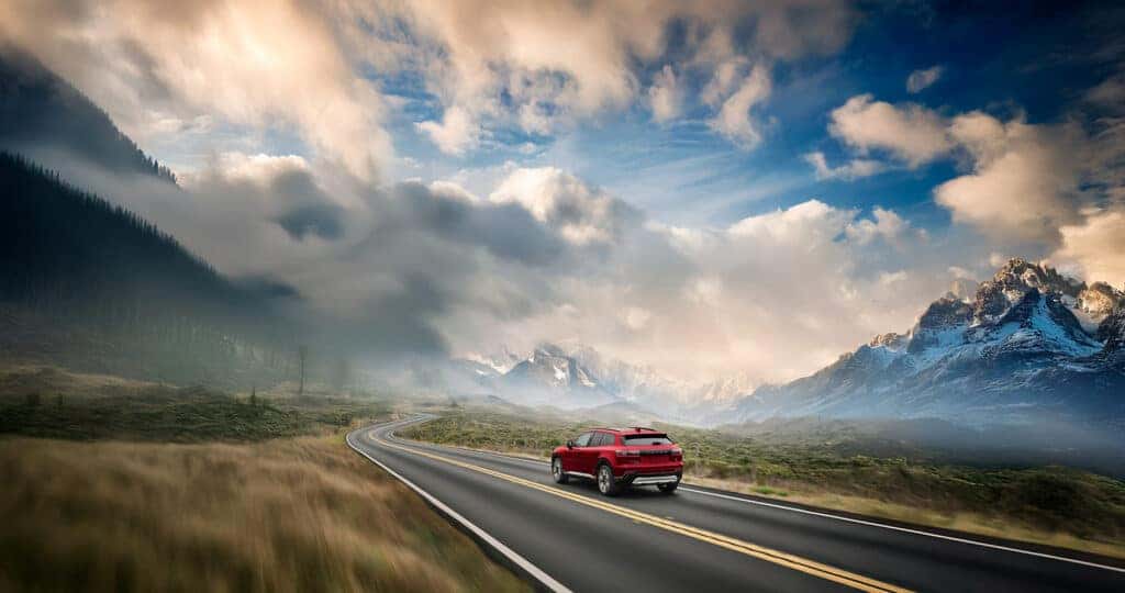 2025 Honda-Prologue-driving-through-a-mountain-valley