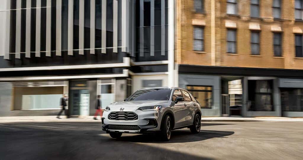 2025 Honda HR-V dimensions shown while driving down city street