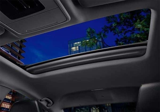 2025 Honda Accord Hybrid showing the sunroof open at night