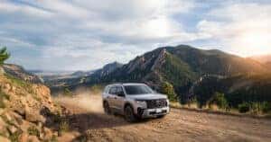 A silver Trailsport Honda Pilot trim level driving up a dirt roads through the Flat Iron mountain range