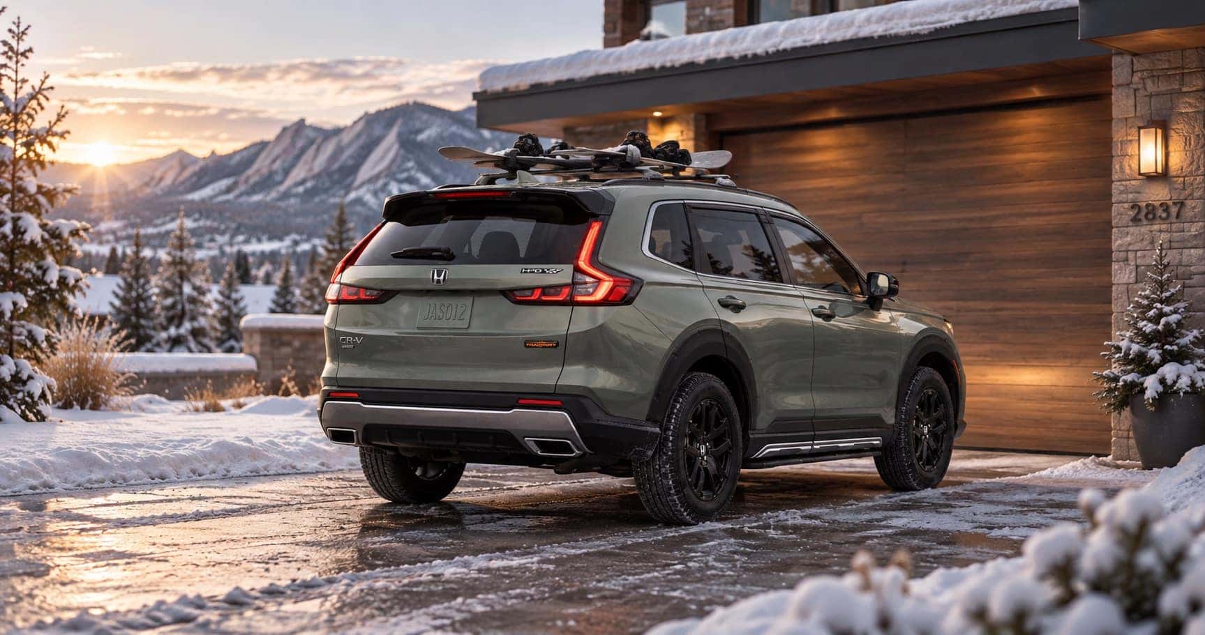 2027 Honda CR-V TrailSport parked in a snowy Boulder, CO driveway