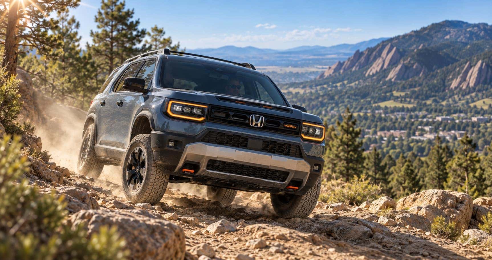 2027 Honda Passport TrailSport driving on a rocky trail near Boulder, CO