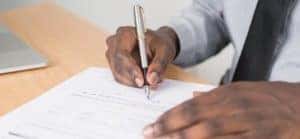 man-filling-out-paperwork