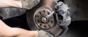 Technician servicing brakes