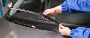 Technicians repairing wiper blades