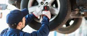 Acura technician installing tires