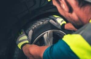 Tire,And,Wheel,Service ,Men,Preparing,Equipment,For,A,Tire