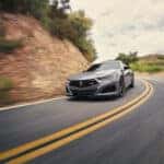 Acura TLX curving around mountain
