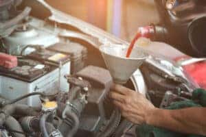 Pouring new transmission fluid