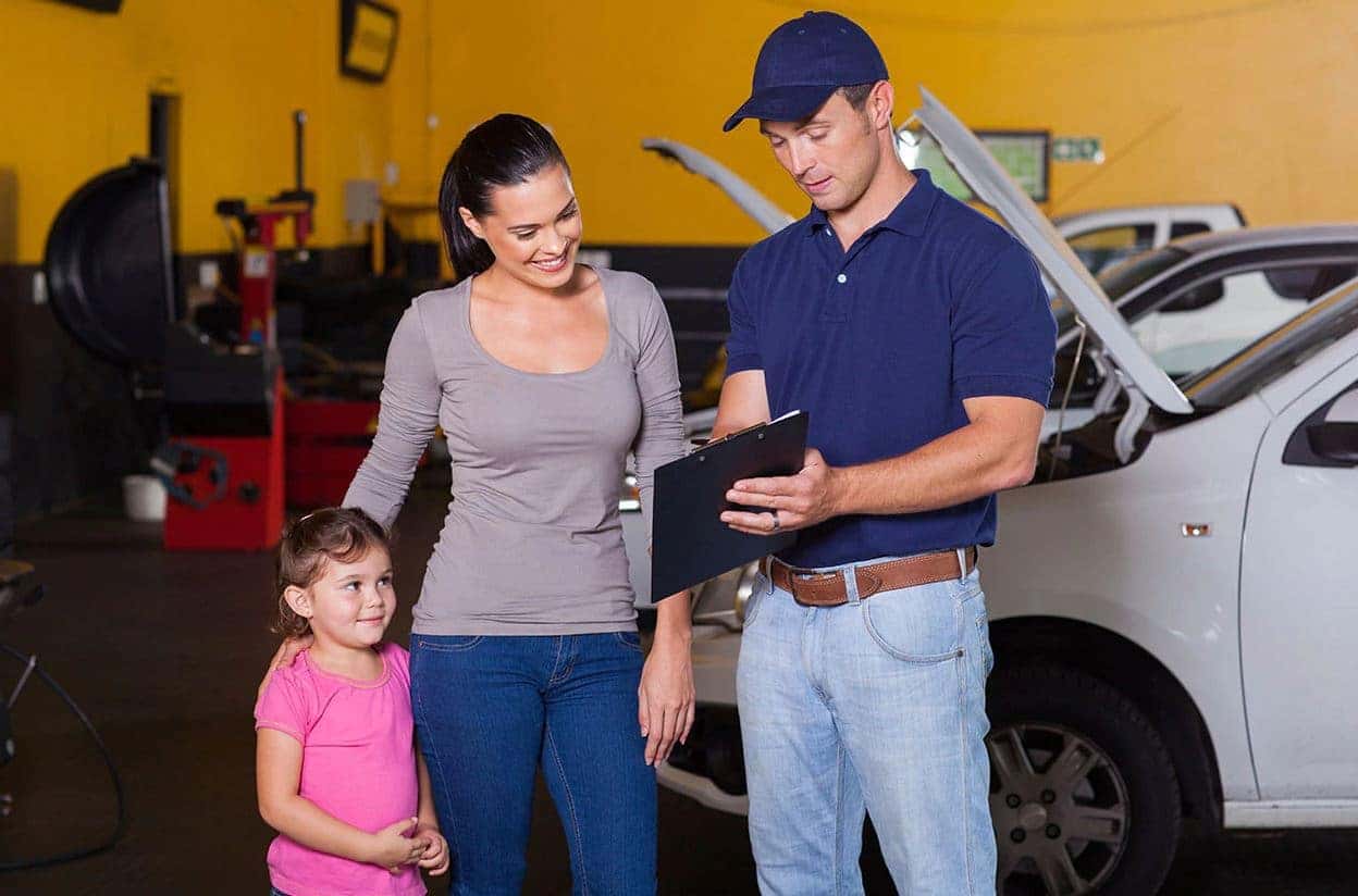 Genesis service tech with customer