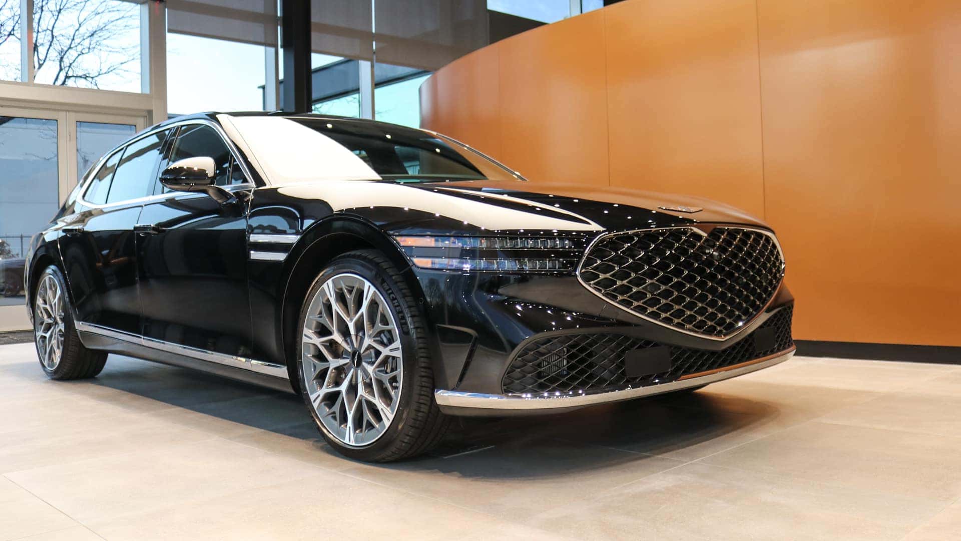 Front view of the 2025 Genesis G90 with signature grille and LED headlights