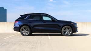 Side profile of the Genesis GV70 luxury SUV highlighting its sleek, athletic design