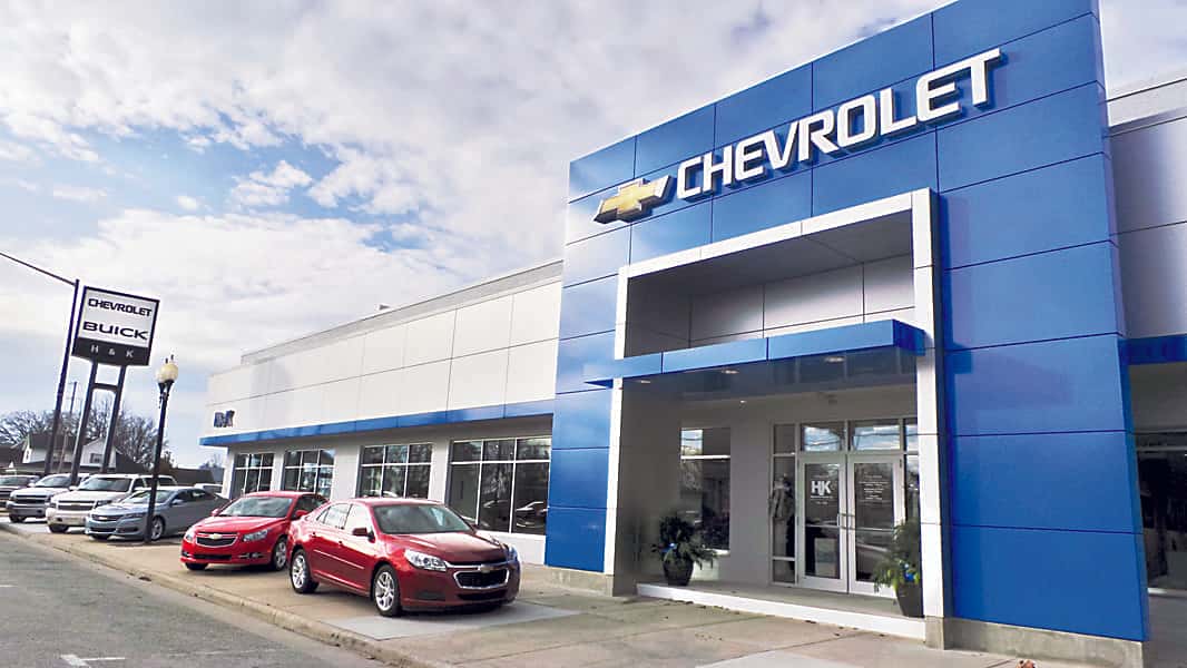 An exterior shot of a Chevrolet dealership in the afternoon.