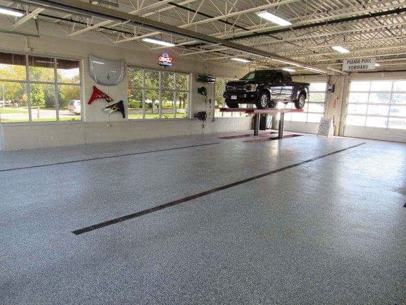 Holz Motors Body Shop vehicle on lift