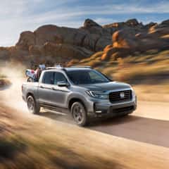 A side facing silver Honda Ridgeline