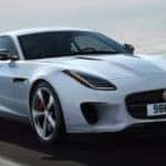 white 2018 f-type driving on highway