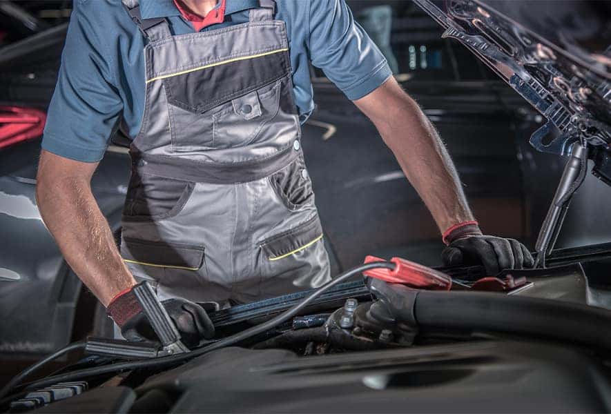 Battery Information at Lancaster Toyota | Service Advisor Jump Starting Battery in Vehicle