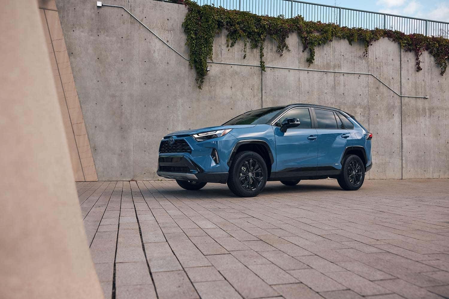 The All-New 2022 Toyota RAV4 Hybrid at Lancaster Toyota | 2022 Toyota RAV4 Hybrid driving on a brick road