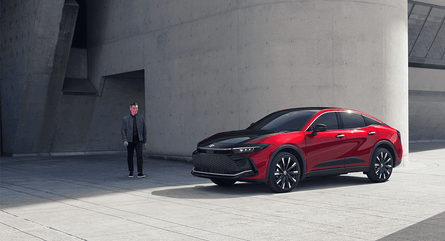 2023 Toyota Crown at Lancaster Toyota in East Petersburg, PA | Man starring at his parked 2023 Toyota crown in the color red