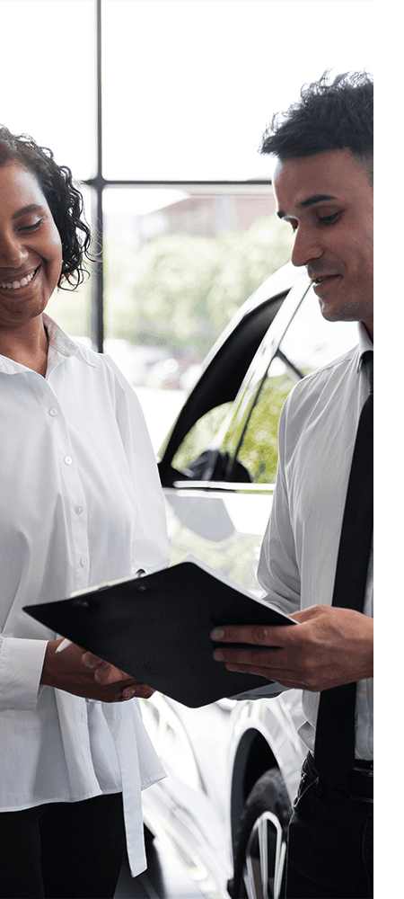 Defining APR at Lancaster Toyota in East Petersburg, PA | Sales person showing customer the APR rates on clipboard  
