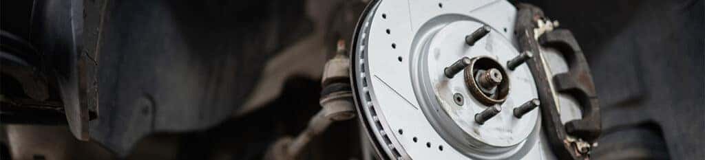 Brake replacement and Safety at Lancaster Toyota | Close up of new brake rotor and brake pads installed