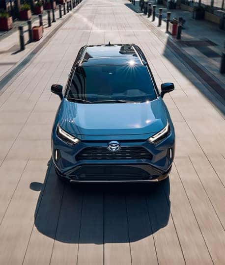 2025 Toyota RAV4, Hybrid, PHEV at Lancaster Toyota in East Petersburg, PA | 2025 Toyota RAV4 driving down the street