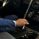 Man shifting 2026 Discovery Tempest into drive.