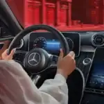 Driver in a vehicle equipped with Mercedes-Benz safety features