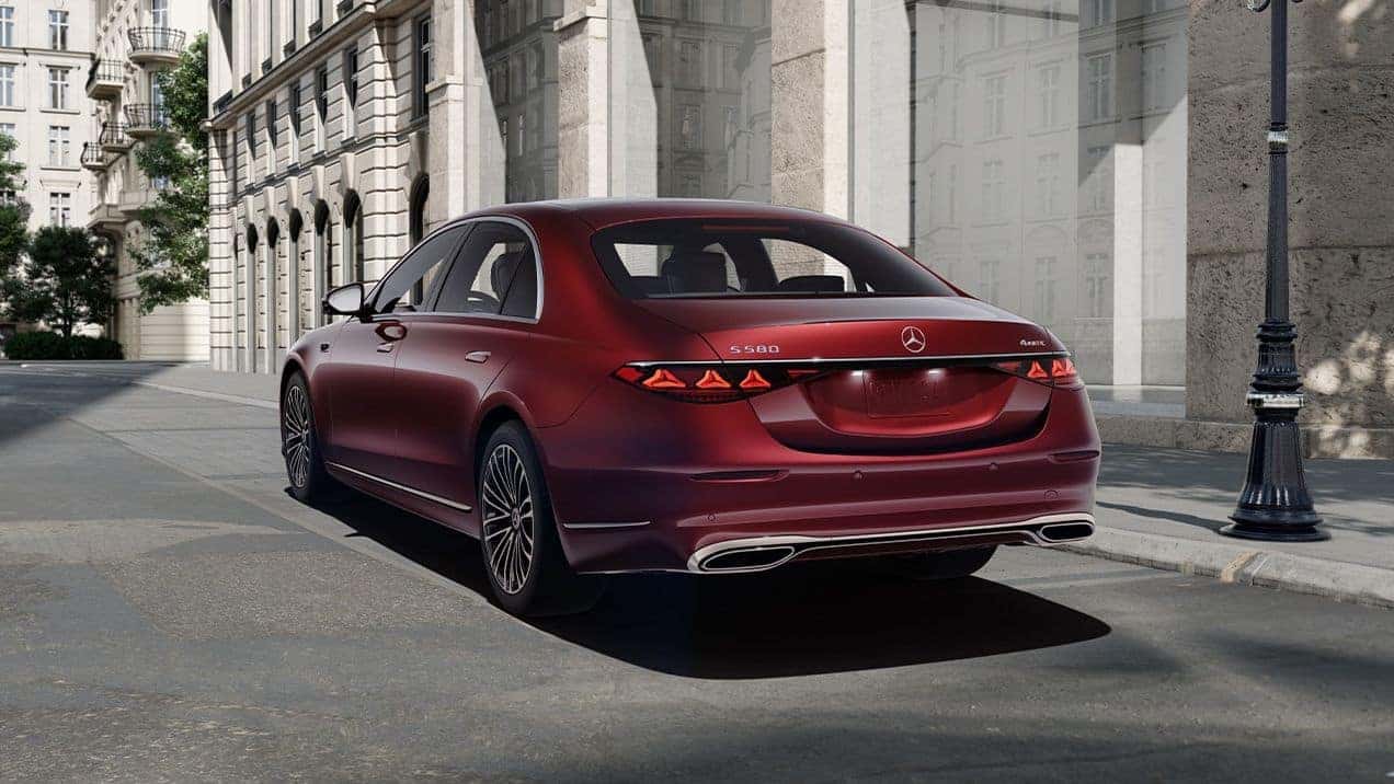 Red 2027 Mercedes-Benz S-Class Sedan parked in front of a building