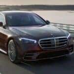 2023 Mercedes-Benz S-Class driving down the highway.