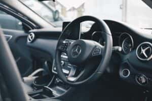 interior view of a Mercedes-Benz showing the steering wheel and dashboard