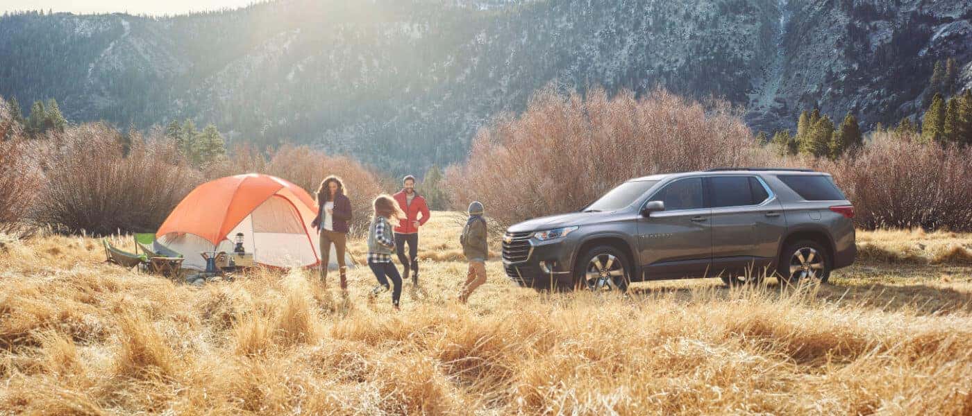20Chevy-Traverse-Exterior parked at camping site in the mountians with Family Camping