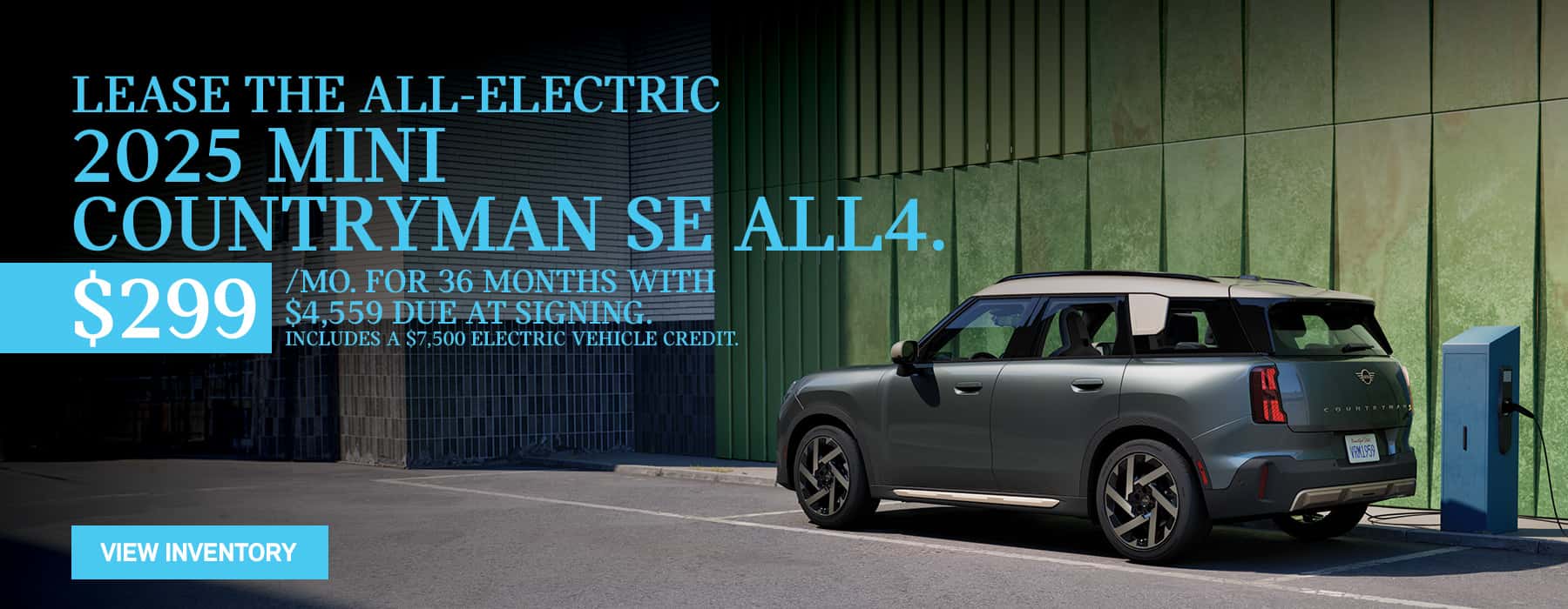 MINI Countryman Parked in front of green wall charging