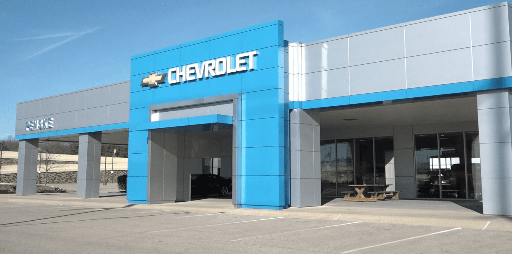 An exterior shot of a Chevrolet dealership at night.